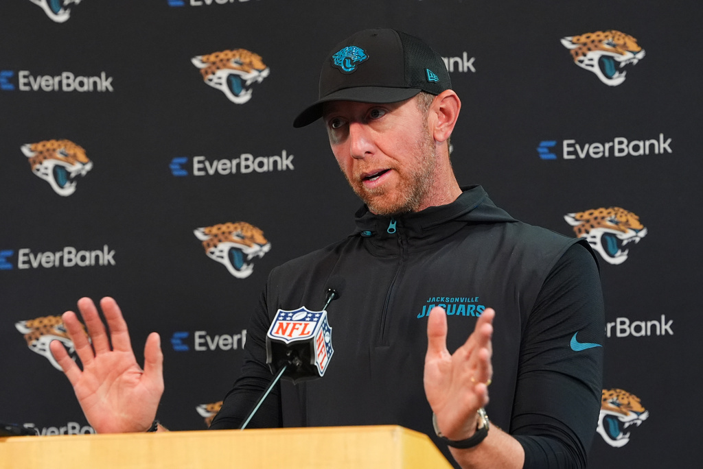 Jacksonville Jaguars head coach Liam Coen responds to a question during a news conference after an NFL football game Sunday, Sept. 20, 2026, in Denver. (AP Photo/David Zalubowski)