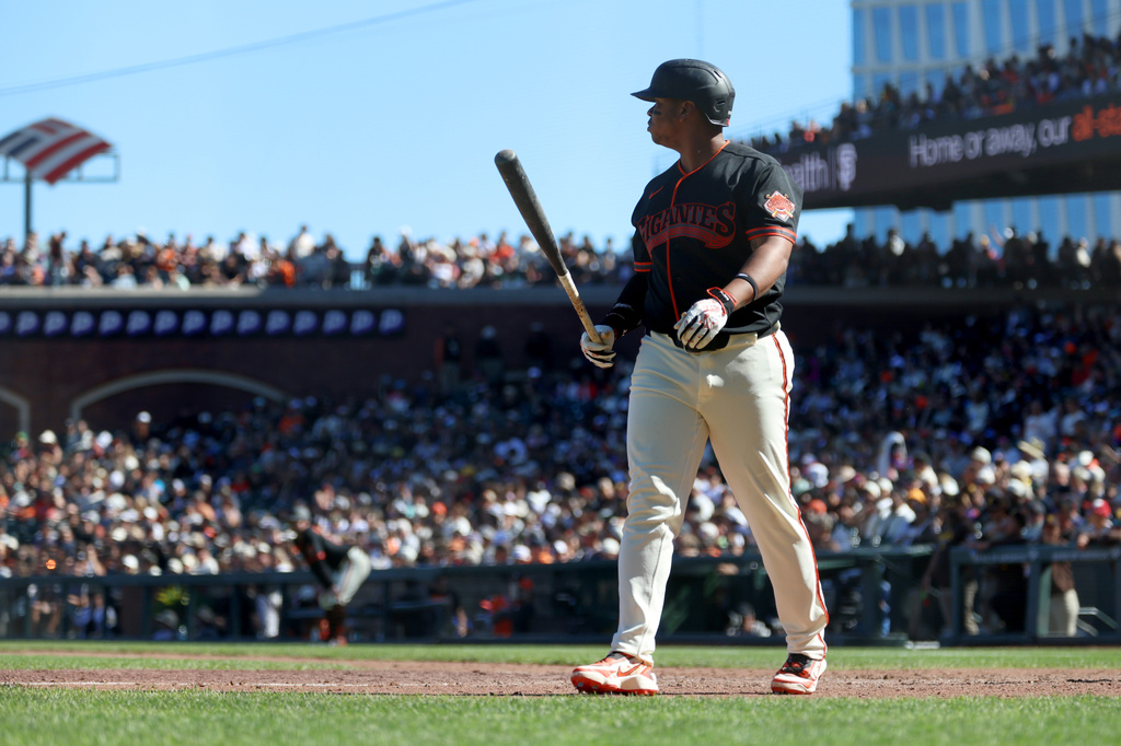 San Francisco Giants' Rafael Devers walks back to the dugout after striking out during the eighth inning of a baseball game against the San Diego Padres in San Francisco, Saturday, Sept. 12, 2026. (AP Photo/Jed Jacobsohn)