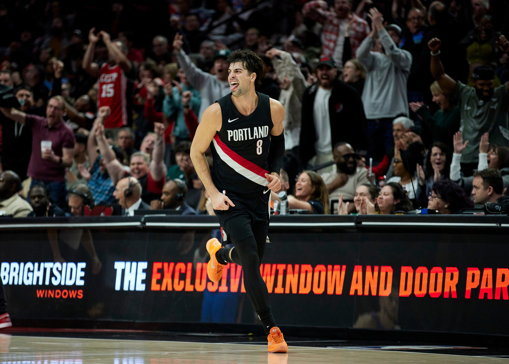 Portland Trail Blazers forward Deni Avdija reacts after making a 3-point basket against the Oklahoma City Thunder during the second half of an NBA basketball game in Portland, Ore., Wednesday, Nov. 5, 2025. (AP Photo/Craig Mitchelldyer)