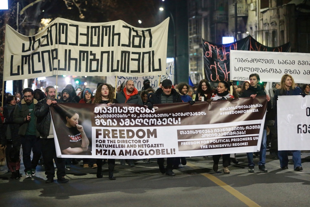 FILE - Protesters hold banners calling for the release of jailed journalist Mzia Amaghlobeli as they march through the streets in Tbilisi, Georgia, on Jan. 29, 2025. (AP Photo/Zurab Tsertsvadze, File)
