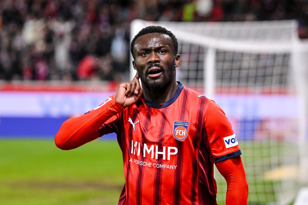 Heidenheim's Sirlord Conteh celebrates scoring during the Bundesliga soccer match between FC Heidenheim and VfB Stuttgart in Heidenheim, Germany, Sunday Feb. 22, 2026. (Harry Langer/dpa via AP)