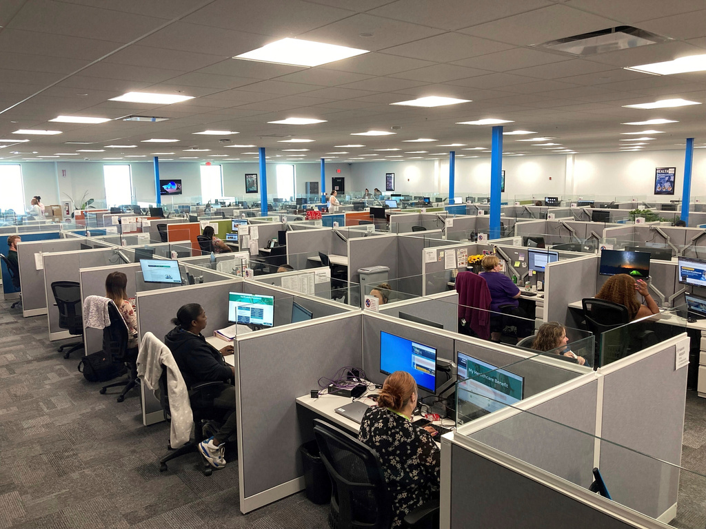 FILE - Workers at a Medicaid call center in Jefferson City, Mo., field questions and review information regarding eligibility determinations on Aug. 16, 2023. (AP Photo/David A. Lieb, FIle)