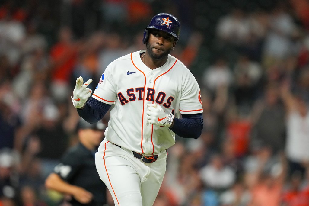 Houston Astros' Yordan Alvarez gestures towards the dugout after he hit a home run during the fifth inning of a baseball game against the Boston Red Sox in Houston, Tuesday, March 31, 2026. (AP Photo/Jon Shapley)