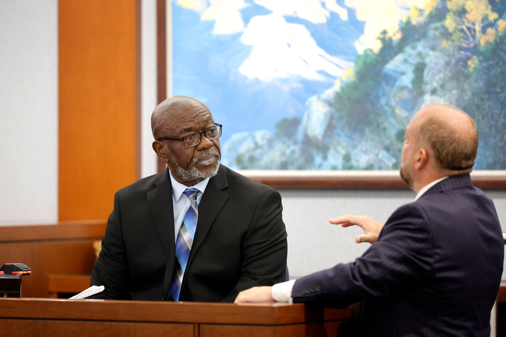 Former Las Vegas Metro Police officer Charlie Mangrum listens to Chief Deputy District Attorney Marc DiGiacomo during the Duane Davis trial, related to the 1996 killing of rapper Tupac Shakur, in Clark County District Court at the Regional Justice Center in Las Vegas on Thursday, Aug. 27, 2026. (Steve Marcus/Las Vegas Sun via AP, Pool)