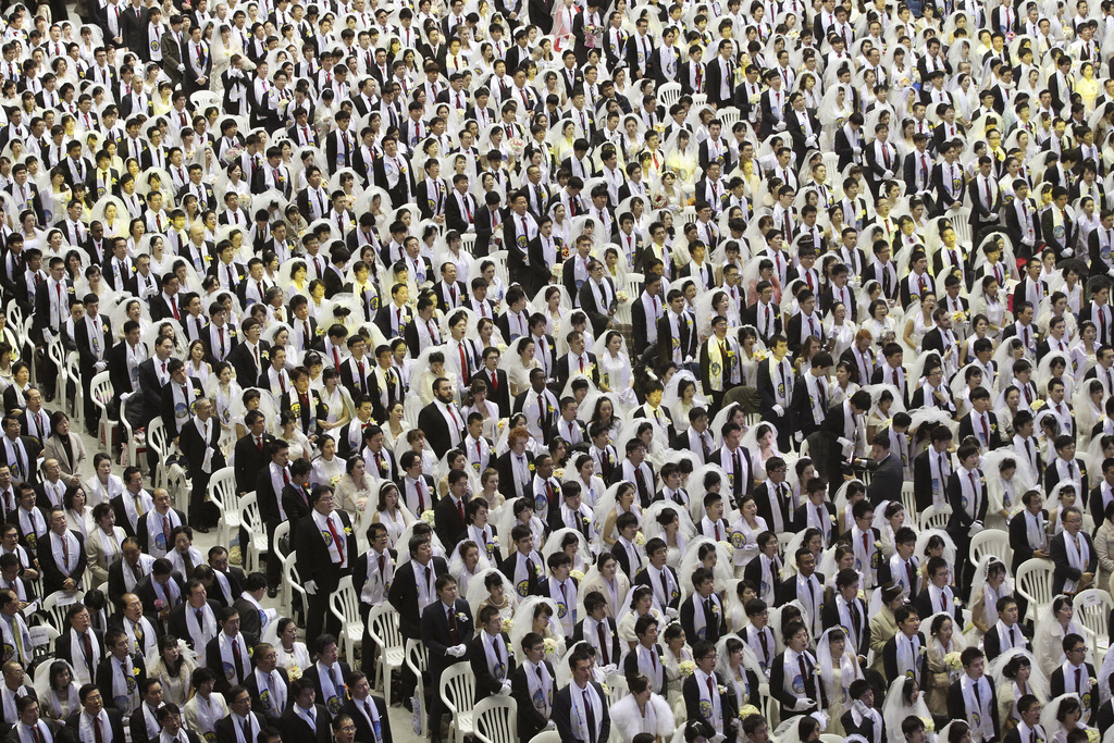 FILE - Couples from around the world participate in a mass wedding ceremony at the Cheong Shim Peace World Center in Gapyeong, South Korea, on March 3, 2015. (AP Photo/Ahn Young-joon, File)