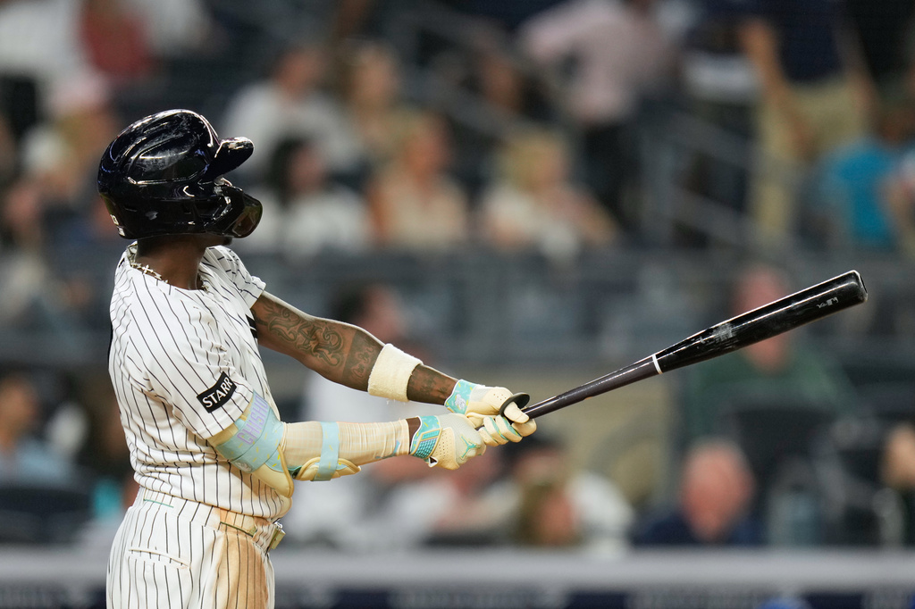 New York Yankees' Jazz Chisholm Jr. looks after his two-run home run during the seventh inning of a baseball game against the Toronto Blue Jays, Monday, May 18, 2026, in New York. (AP Photo/Seth Wenig)