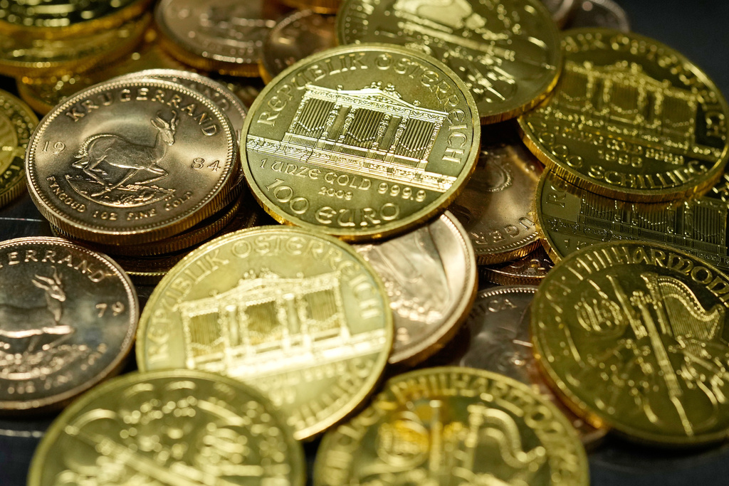 FILE - 1 Ounce Fine Gold Coins are displayed in the safe deposit boxes room at the Pro Aurum gold house in Munich, Germany, Friday, April 25, 2025. (AP Photo/Matthias Schrader, File)