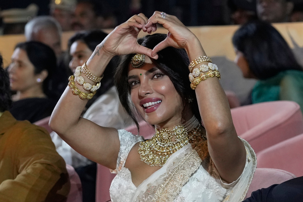 Actress Priyanka Chopra Jonas gesture her fans before unveiling of first look of film "Varanasi" in Hyderabad, India, Saturday, Nov. 15, 2025. (AP Photo/Mahesh Kumar A.)