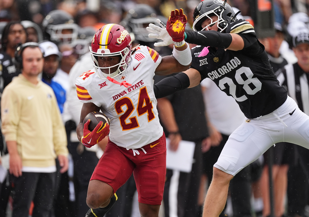 Iowa State running back Abu Sama, left, is pushed out of bounds, after a long gain, by Colorado defensive back Ben Finneseth in the first half of an NCAA college football game Saturday, Oct. 11, 2025, in Boulder, Colo. (AP Photo/David Zalubowski)