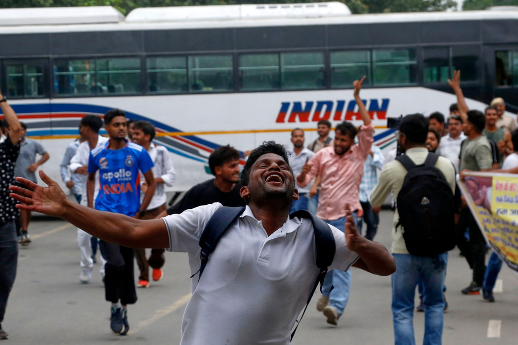 Supporters of the Cockroach Janta Party attempt to march to India's Parliament, demanding the resignation of the education minister, in New Delhi, Monday, July 20, 2026. (AP Photo/Shekhar Yadav)