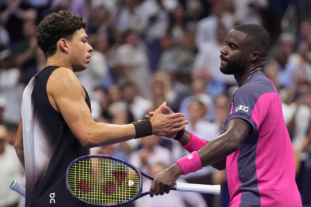 Frances Tiafoe, of the United States, right, greets Ben Shelton, of the United States, after Shelton won their match during the men's singles semifinals of the U.S. Open tennis championships Friday, Sept. 11, 2026, in New York. (AP Photo/Frank Franklin II)