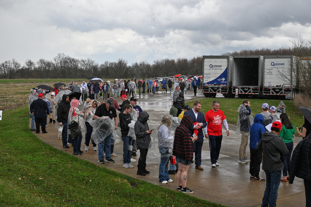 People wait in line to enter before President Donald Trump speaks at Verst Logistics in Hebron, Ky., Wednesday, March 11, 2026. (AP Photo/Jon Cherry)
