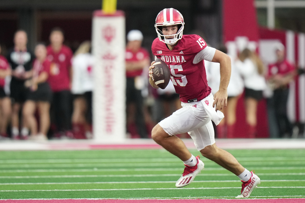 FILE - Indiana quarterback Fernando Mendoza (15) runs during the first half of an NCAA college football game against the Michigan State, Saturday, Oct. 18, 2025, in Bloomington, Ind. (AP Photo/AJ Mast, File)