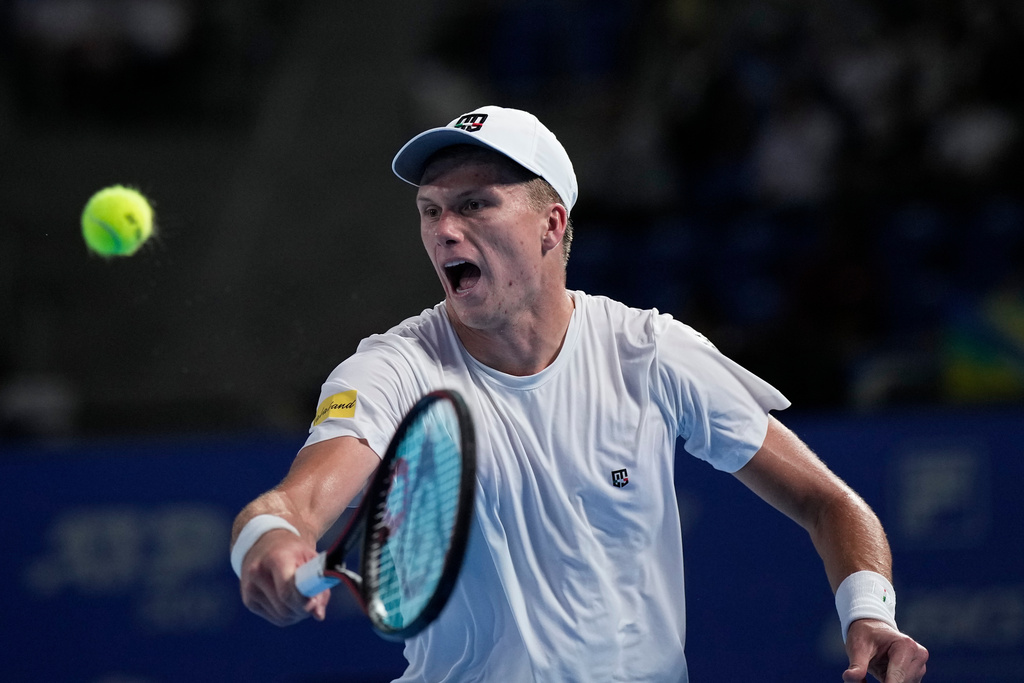 United States' Jenson Brooksby plays a shot against United States' Taylor Fritz during the men's singles semi final match of the Tokyo ATP 500 tennis tournament at Ariake Coliseum, in Tokyo, Monday, Sept. 29, 2025. (AP Photo/Louise Delmotte)