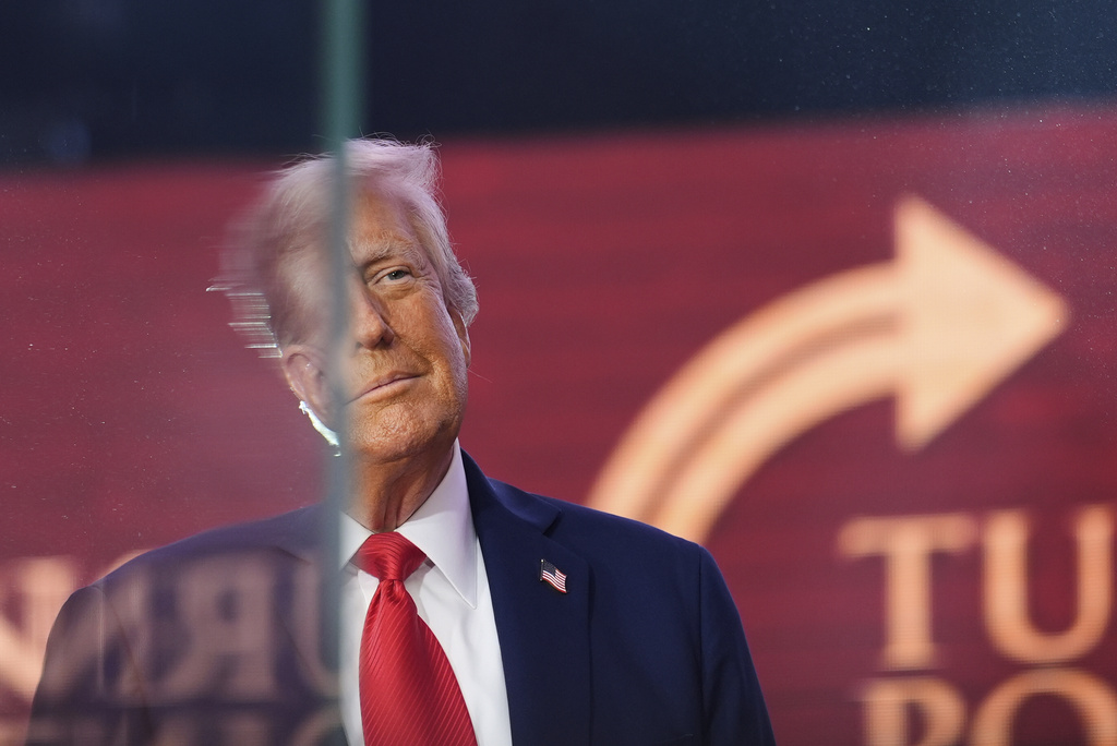 President Donald Trump arrives to speak at a memorial for conservative activist Charlie Kirk, Sunday, Sept. 21, 2025, at State Farm Stadium in Glendale, Ariz. (AP Photo/Julia Demaree Nikhinson)