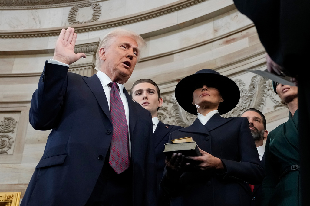 FILE - Donald Trump is sworn in as the 47th president of the United States by Chief Justice John Roberts as Melania Trump holds the Bible during the 60th Presidential Inauguration in the Rotunda of the U.S. Capitol in Washington, Jan. 20, 2025. (AP Photo/Morry Gash, Pool, File)