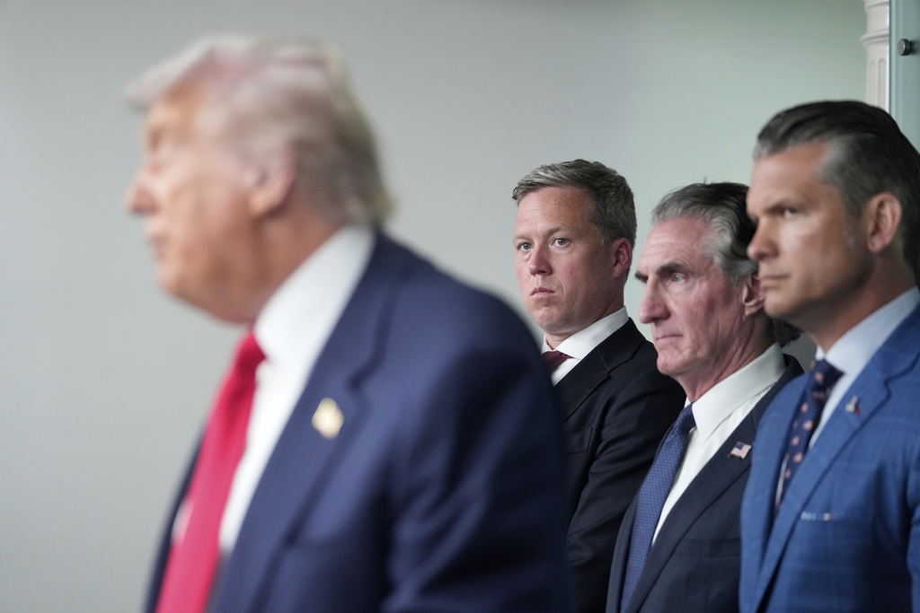 President Donald Trump, from left, speaks with reporters as Army Secretary Dan Driscoll, Interior Secretary Doug Burgum and Defense Secretary Pete Hegseth listen in the James Brady Press Briefing Room at the White House, Monday, Aug. 11, 2025, in Washington. (AP Photo/Mark Schiefelbein)