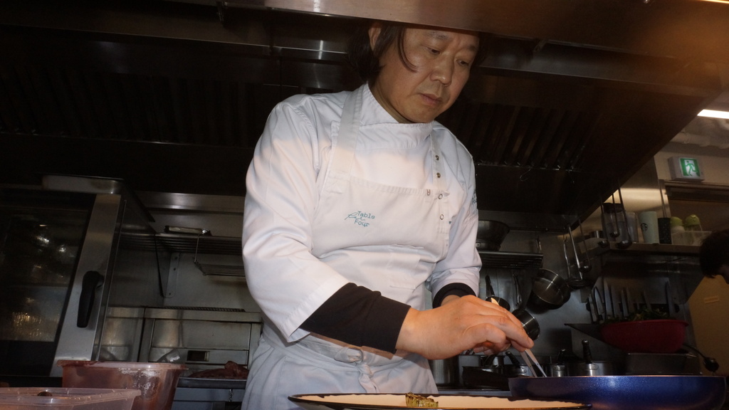 Kim Sung-woon, the chef and owner of Table for Four, cooks his signature dish on Jan. 31, 2026, in Seoul, South Korea (AP Photo/ Juwon Park)