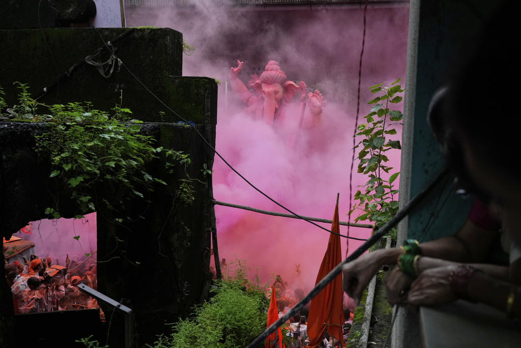 An idol of elephant-headed Hindu god Ganesha is taken for immersion on the final day of the ten-day long Ganesh Chaturthi festival in Mumbai, India, Saturday, Sept. 6, 2025. (AP Photo/Rajanish Kakade)