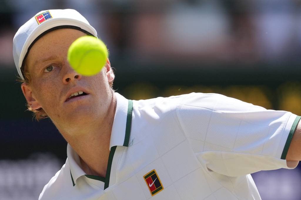 Jannik Sinner of Italy eyes the ball as he prepares to play a forehand against Jan-Lennard Struff of Germany in their quarter-final men's singles match at the Wimbledon Tennis Championships in London, Tuesday, July 7, 2026. (AP Photo/Kin Cheung)