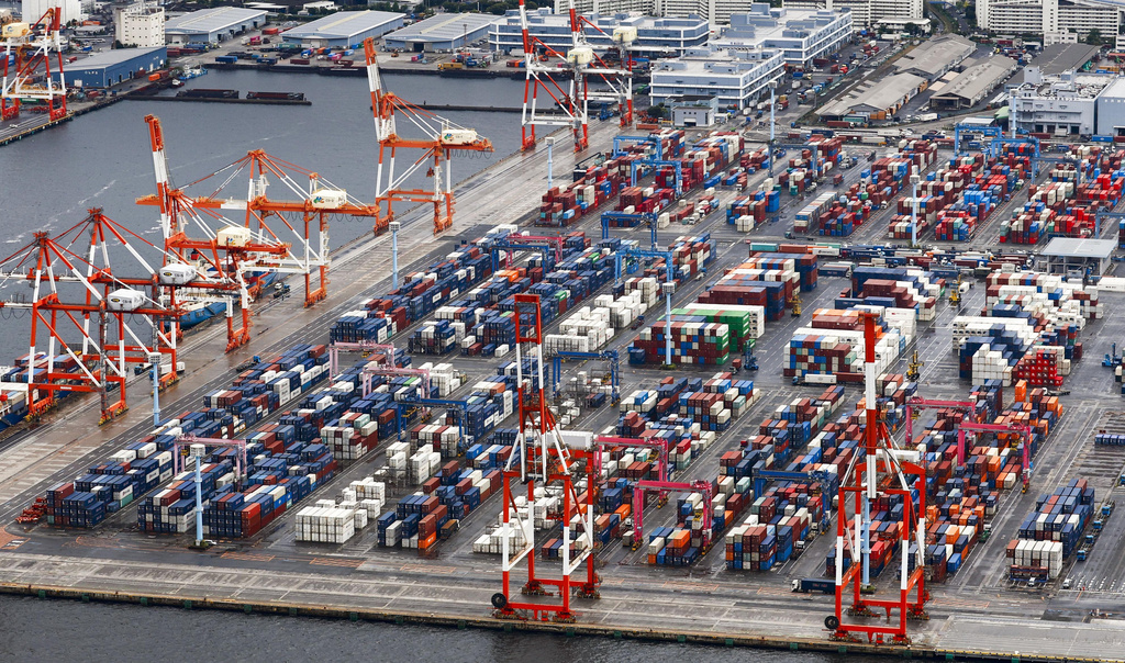 Containers are stacked at a port in Yokohama, near Tokyo on Aug. 1, 2025. (Takuto Kaneko/Kyodo News via AP)