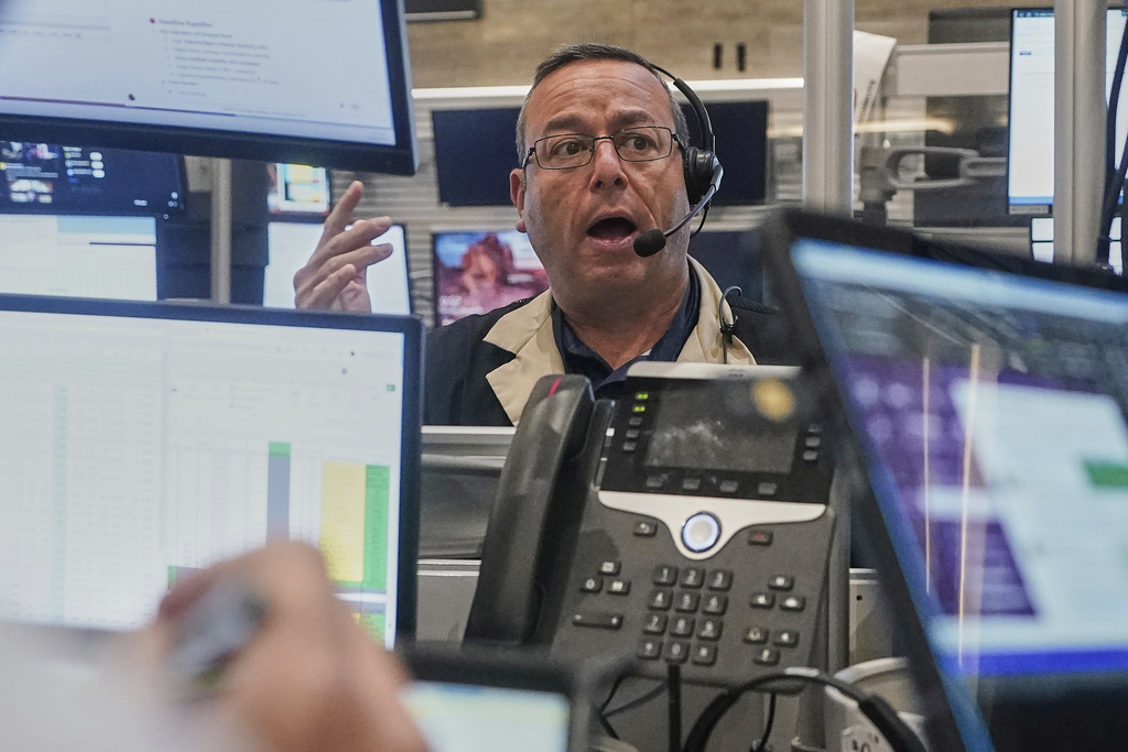 Options traderMatthew Hefner works on the floor of the New York Stock Exchange, Monday, Aug. 18, 2025. (AP Photo/Richard Drew)