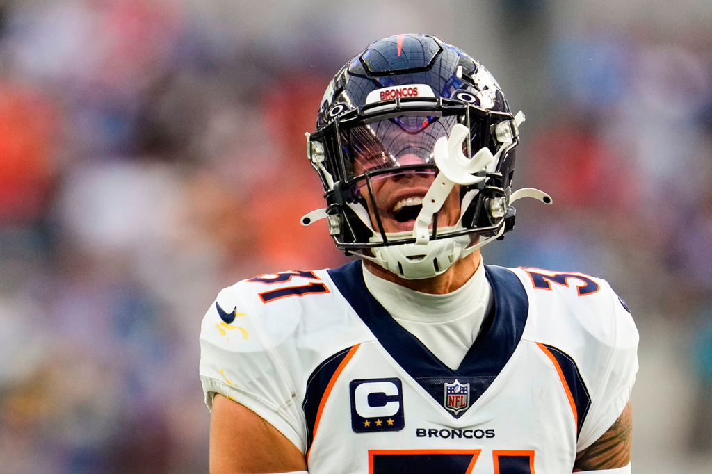 FILE - Denver Broncos safety Justin Simmons (31) reacts to a sack on Los Angeles Chargers quarterback Justin Herbert by teammate Zach Allen during the first half of an NFL football game Sunday, Dec. 10, 2023, in Inglewood, Calif. (AP Photo/Marcio Jose Sanchez, File)