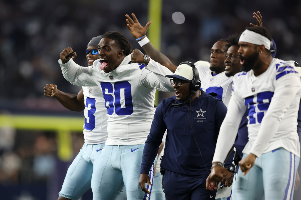 Dallas Cowboys offensive tackle Tyler Guyton (60) celebrates on the sideline after a two-point conversion against the New Orleans Saints during the second half of a preseason NFL football game, in Arlington, Texas, Friday, Aug. 28, 2026. (AP Photo/Gareth Patterson)