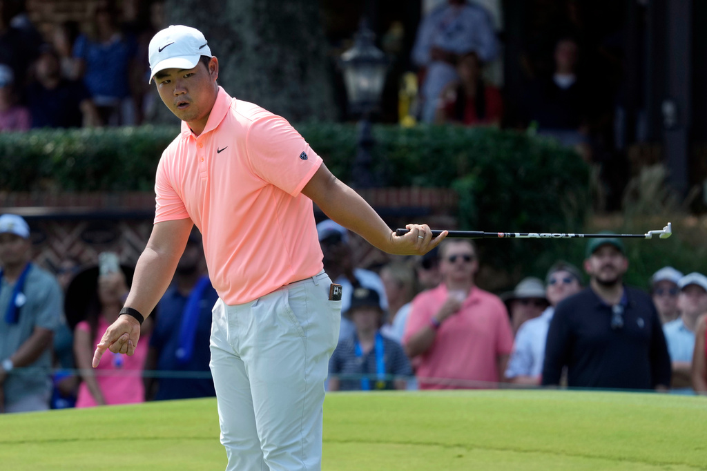 Tom Kim, of South Korea, reacts to a missed putt on the ninth hole during the final round of the Wyndham Championship golf tournament in Greensboro, N.C., Sunday, Aug. 9, 2026. (AP Photo/Chuck Burton)
