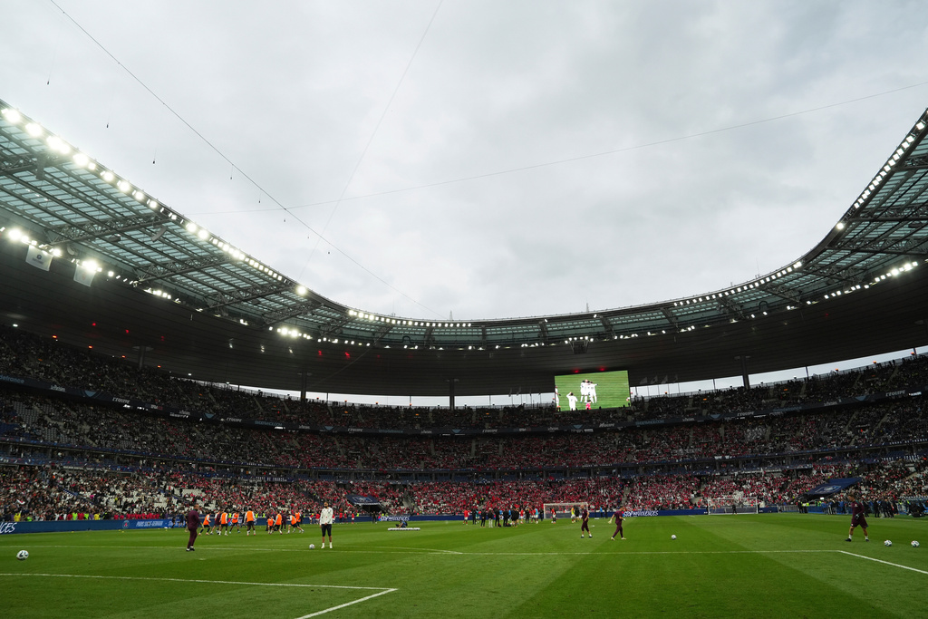 FILE - Players of Paris Saint-Germain and Reims warm up prior to the French Cup soccer final at the Stade de France stadium in Saint-Denis, outside Paris, Saturday May 24, 2025. (AP Photo/Aurelien Morissard, file)