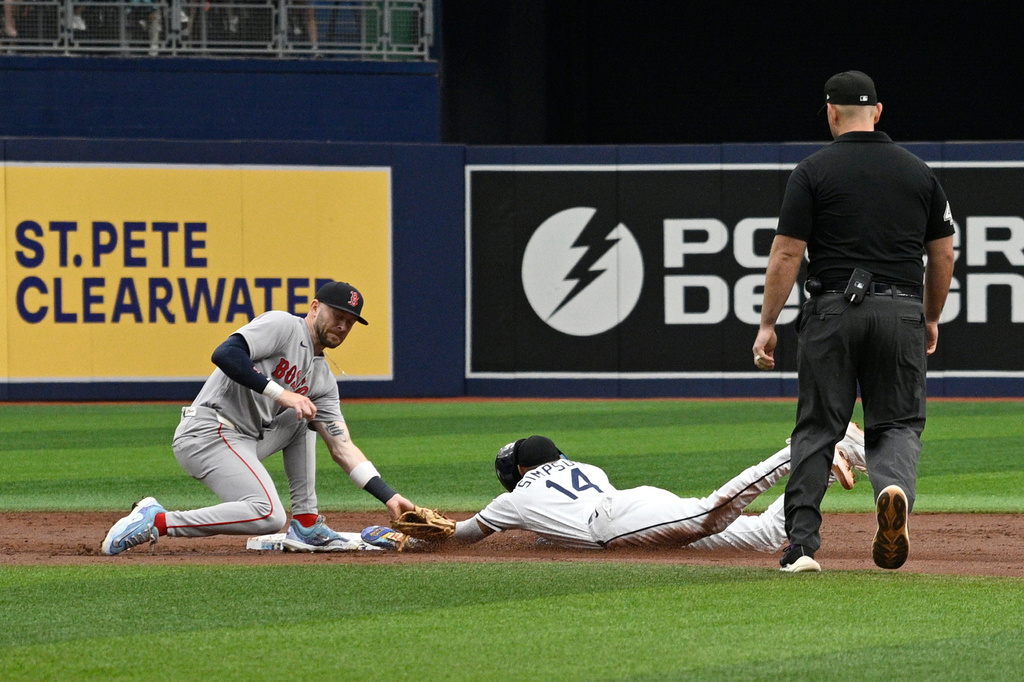 Tampa Bay Rays' Chandler Simpson (14) steals second base as Boston Red Sox shortstop Trevor Story, left, is late with the tag during the first inning of a baseball game, Sunday, Sept. 20, 2026, in St. Petersburg, Fla. (AP Photo/Phelan M. Ebenhack)