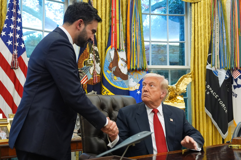 President Donald Trump shakes hands with New York City Mayor-elect Zohran Mamdani in the Oval Office of the White House, Friday, Nov. 21, 2025, in Washington. (AP Photo/Evan Vucci)