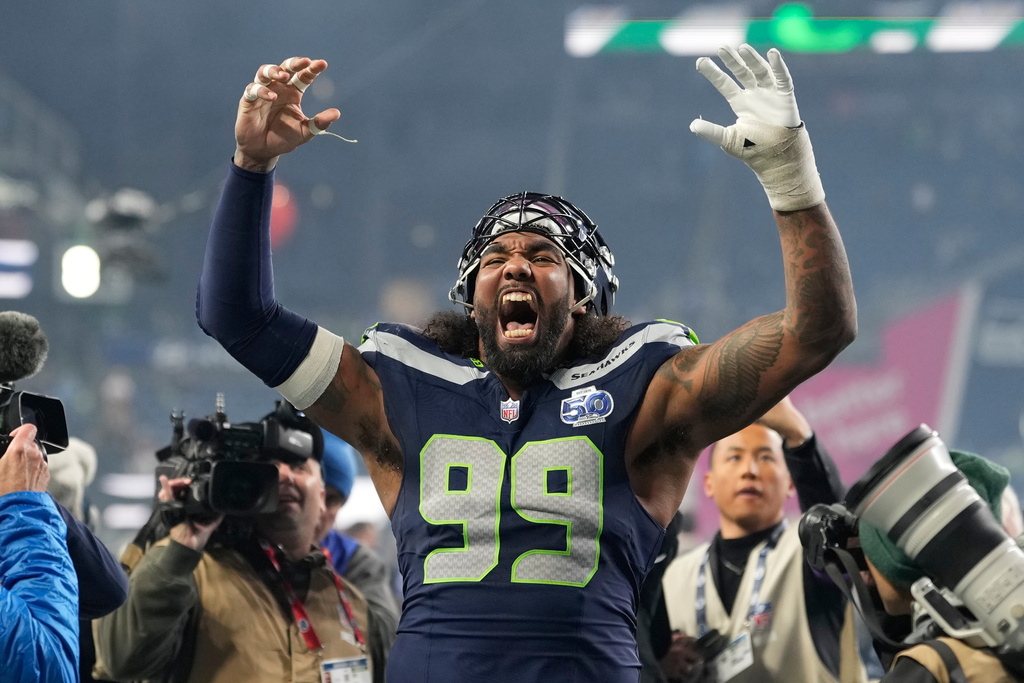 Seattle Seahawks defensive tackle Leonard Williams (99) reacts after NFL football divisional playoff game against the San Francisco 49ers, Saturday, Jan. 17, 2026, in Seattle. (AP Photo/Stephen Brashear)