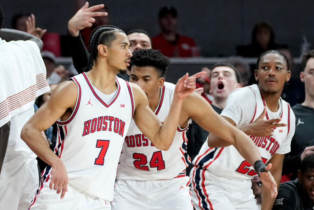 Houston guard Milos Uzan (7) reacts after making a 3-point basket against Colorado during the second half of an NCAA college basketball game Saturday, Feb. 28, 2026, in Houston. (AP Photo/Eric Christian Smith)