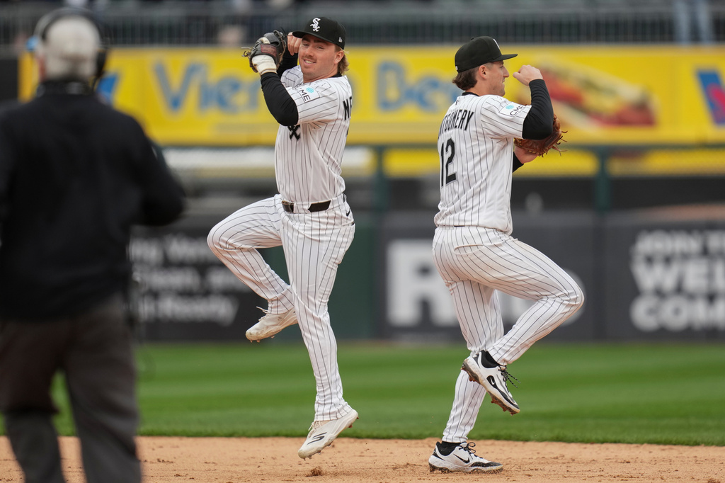 Chicago White Sox second baseman Chase Meidroth, left, and shortstop Colson Montgomery (12) celebrate their team's win over the Toronto Blue Jays following a baseball game Saturday, April 4, 2026, in Chicago. (AP Photo/Erin Hooley)
