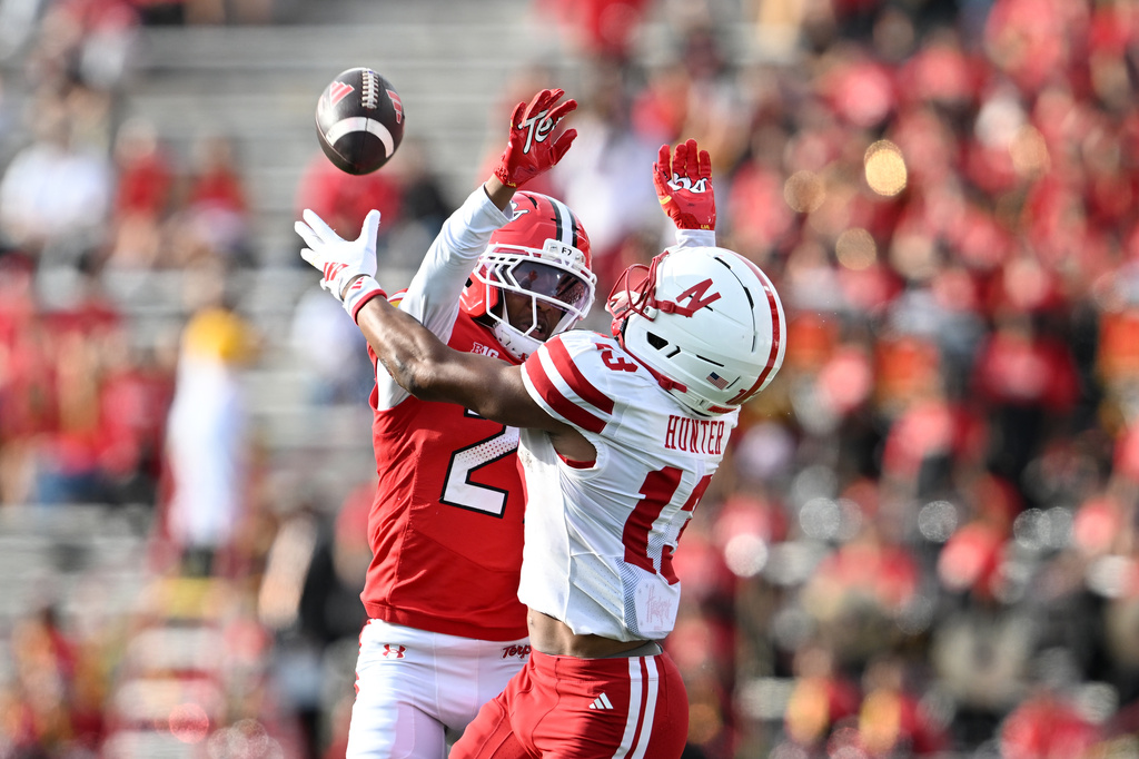 Maryland defensive back La'khi Roland (27) defends a pass to Nebraska wide receiver (13 ) Nyziah Hunter during the first half of a NCAA college football game, Saturday, Oct. 11, 2025, in College Park, Md. Roland was called for a penalty. (AP Photo/Gail Burton)