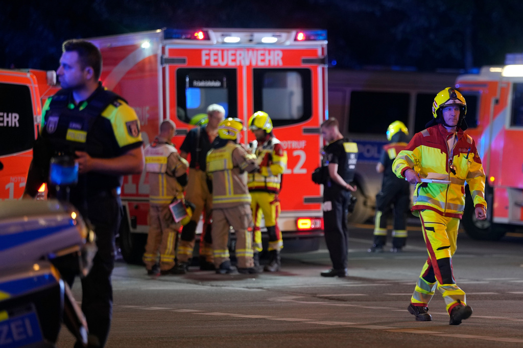 Emergency personnel gather following the cancellation of Christopher Street Day festivities in Berlin, on Saturday, July 25, 2026. (AP Photo/Markus Schreiber)