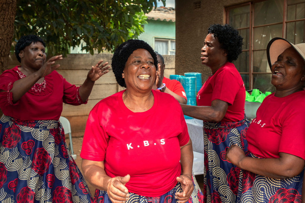 Kuchemana Burial Society members sing and dance during a meeting in Harare, Zimbabwe, March 13, 2026. (AP Photo/Aaron Ufumeli)