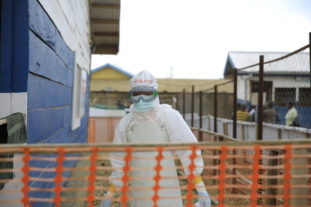 A healthcare worker walks inside a treatment center for Ebola patients in Beni, North Kivu province, eastern Congo, Saturday, Sept. 26, 2026. (AP Photo/Sebastien Kitsa Musayi)