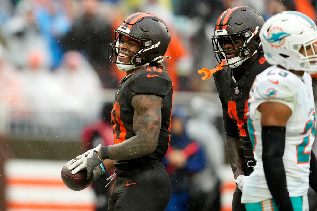 Cleveland Browns running back Quinshon Judkins (10) celebrates after scoring a touchdown against the Miami Dolphins in the first half of an NFL football game in Cleveland, Sunday, Oct. 19, 2025. (AP Photo/Sue Ogrocki)