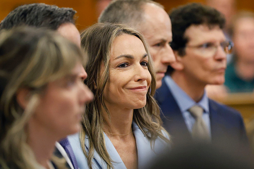 FILE - Karen Read smiles as the not guilty verdict of second-degree murder is read in Norfolk Superior Court, June 18, 2025, in Dedham, Mass. (Greg Derr/The Patriot Ledger via AP, Pool, File)
