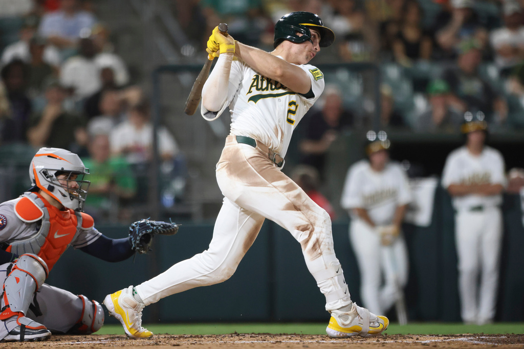 Athletics' Tyler Soderstrom hits an RBI double during the fifth inning of a baseball game against the Houston Astros Tuesday, Sept. 23, 2025, in West Sacramento, Calif. (AP Photo/Scott Marshall)