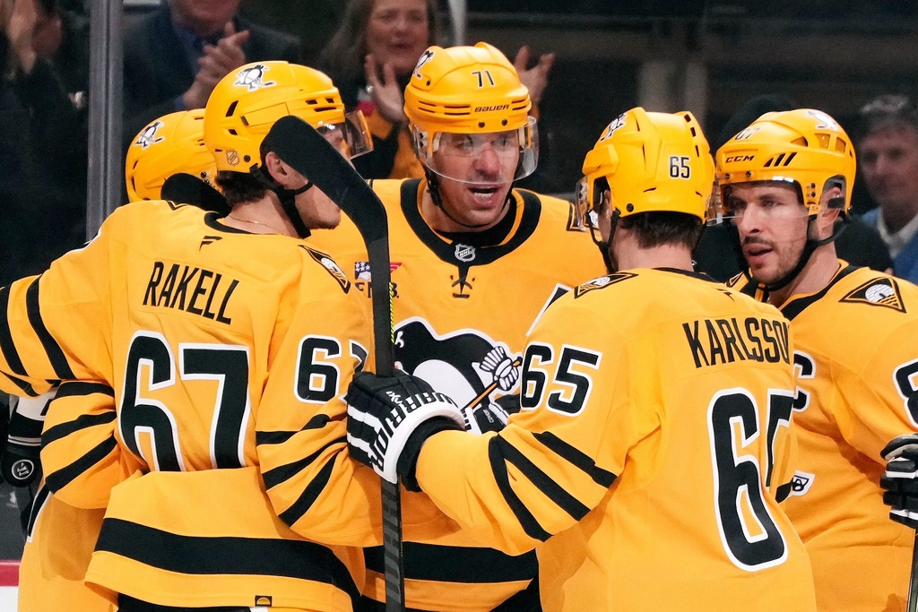 Pittsburgh Penguins' Evgeni Malkin (71) celebrates his goal during the second period of an NHL hockey game against the New Jersey Devils in Pittsburgh, Thursday, Jan. 8, 2026. (AP Photo/Gene J. Puskar)