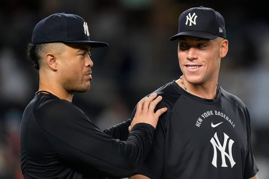 New York Yankees' Aaron Judge, right, and Giancarlo Stanton, left, celebrate after winning a baseball game against the Boston Red Sox, Friday, Aug. 28, 2026, in New York. (AP Photo/Yuki Iwamura)