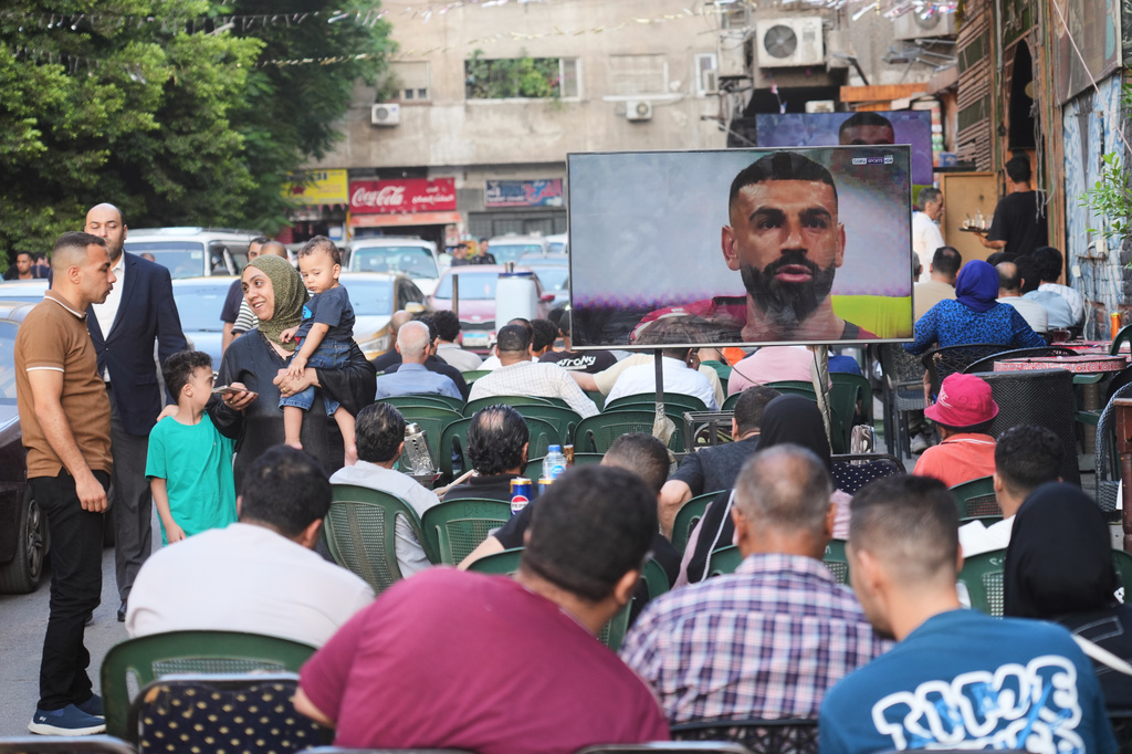 Team captain Mohamed Salah is displayed on a screen as fans watch the World Cup knockout stage match between Egypt and Argentina, in Cairo, Egypt, Tuesday, July 7, 2026. (AP Photo/Amr Nabil)