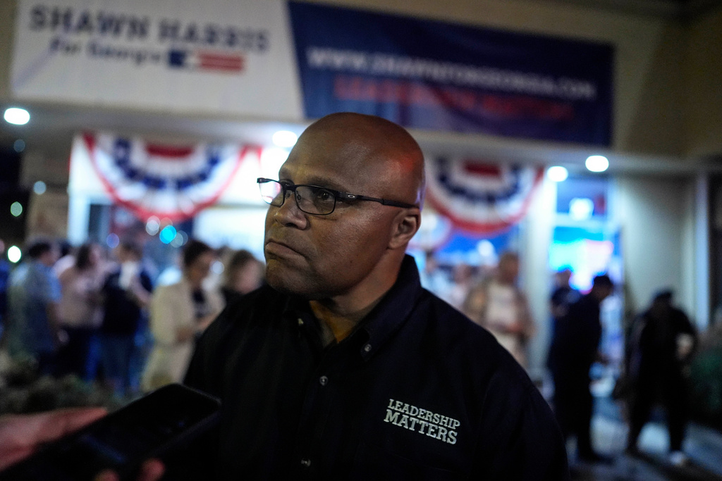 Democratic Shawn Harris speaks to a reporter after learning he would advance to a runoff election against Republican Clay Filler during an election night watch party, Tuesday, March 10, 2026, in Rome, Ga. (AP Photo/Mike Stewart)