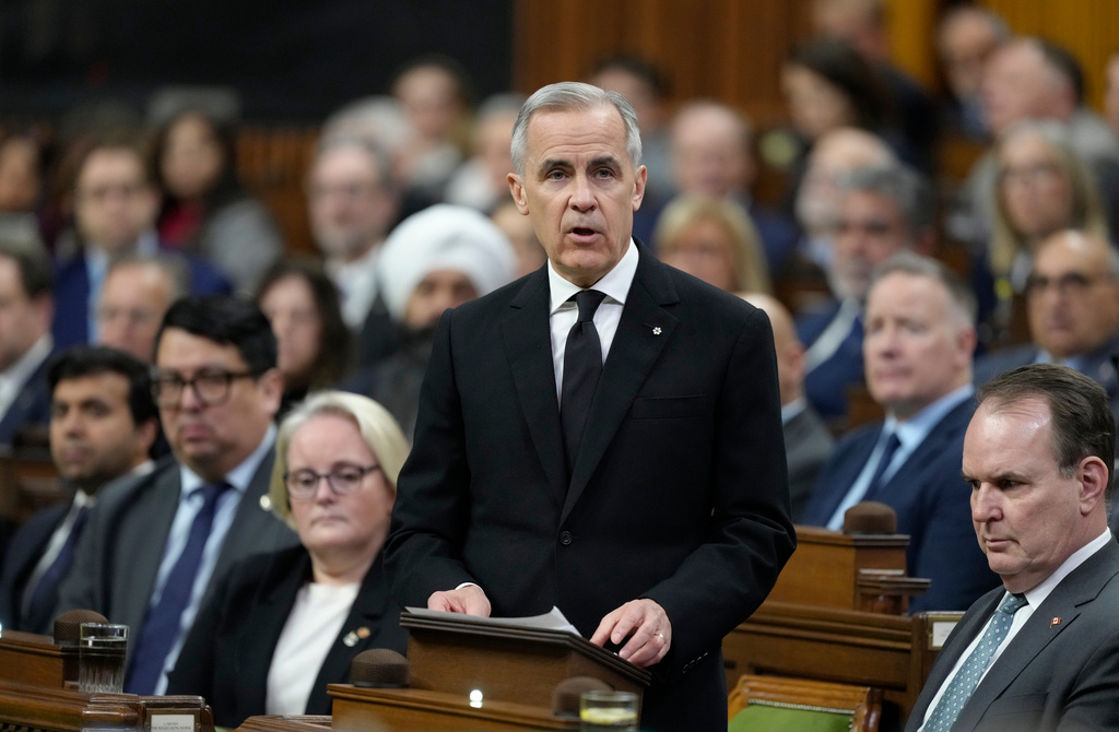 Prime Minister Mark Carney rises in the House of Commons Wednesday, Feb.11, 2026. (Adrian Wyld/The Canadian Press via AP)