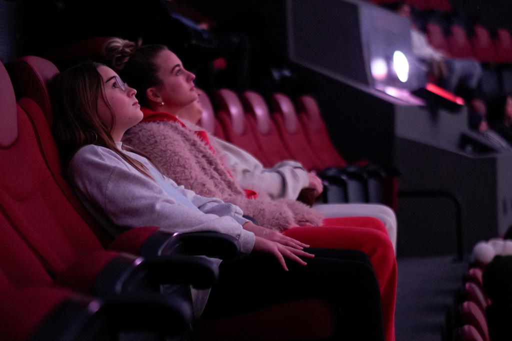Audience members watch "Ohio: Wild at Heart" that features the state's top-rated park system to highlight wildlife conservation efforts and the restorative power of outdoor recreation at the Robert D. Lindner Family OMNIMAX Theater at the Cincinnati Union Terminal, Tuesday, Dec. 30, 2025, in Cincinnati. (AP Photo/Carolyn Kaster)