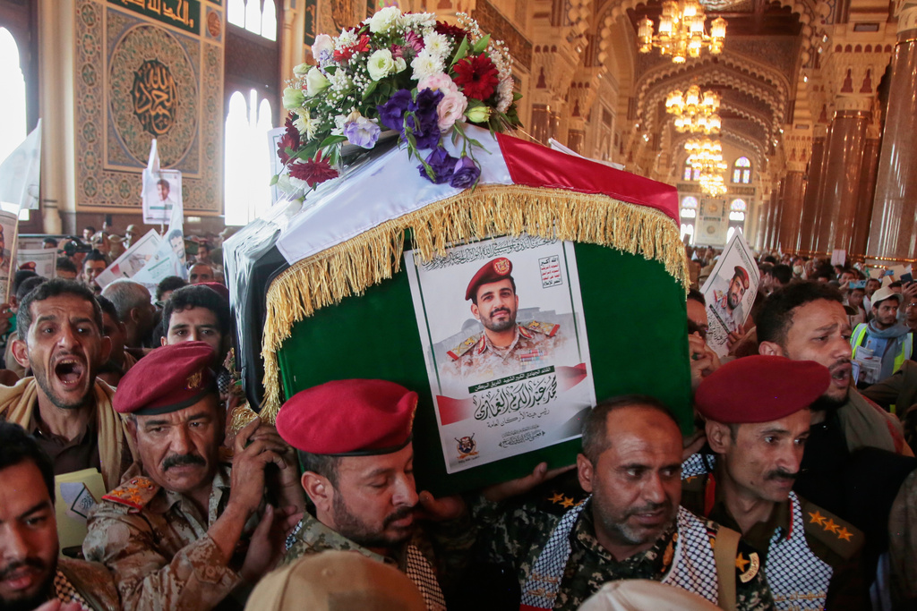 Houthi supporters carry the coffin of Maj. Gen. Muhammad Abdul Karim al-Ghamari, who died of wounds he suffered after an Israeli attack, during his funeral at the people's mosque in Sanaa, Yemen, Monday, Oct. 20, 2025. (AP Photo/Osamah Abdulrahman)