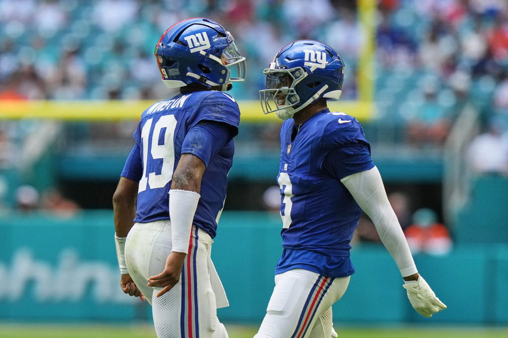 New York Giants quarterback Jameis Winston (19) celebrates with New York Giants wide receiver Odell Beckham Jr. (3) during the first half of a preseason NFL football game against the Miami Dolphins, Saturday, Aug. 22, 2026, in Miami Gardens, Fla. (AP Photo/Lynne Sladky)